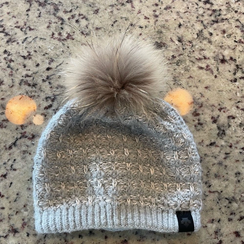 Descente Light Gray Knit Beanie with genuine raccoon Pom-Pom